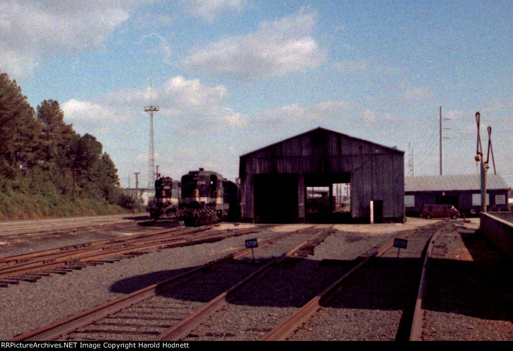 A GP30 & GP38-2 rest beside the engine house in Glenwood Yard